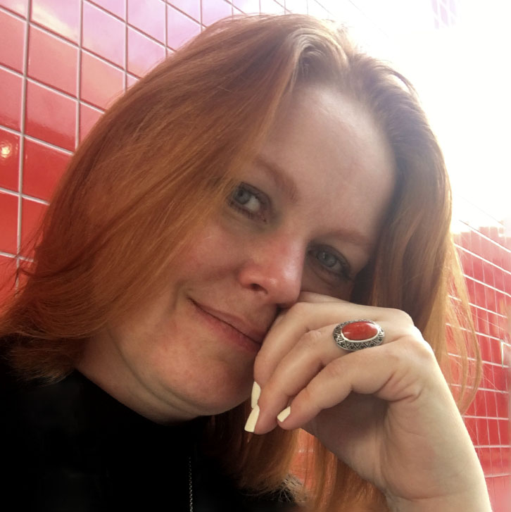 Portrait of Majken Sander on red tile background