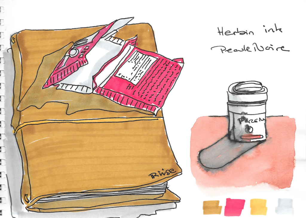 skitse af læderindbundet notesbog med en åben pakke chokolade oven på og en lille metal beholder til blæk ved siden af